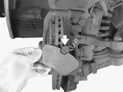Apply small amount of Mercedes-Benz heat resistant paste to two edges of brake pad that make contact with guide channels in caliper and back of brake pad.
Insert pad wear sensor (arrow) in inner pad slot.
Insert new brake pads into pad carrier.
Chapter 3: Maintenance
page 71