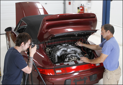 Bentley technical editor checking for voltage at engine harness.